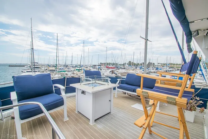 Slide: The Image of Deck view of 1990 Kha Shing Flush Deck Motor Yacht in marina setting. - 52