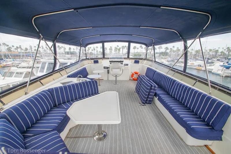 Slide: The Image of Luxurious 1990 Kha Shing Flush Deck Motor Yacht with spacious seating and marina view. - 41