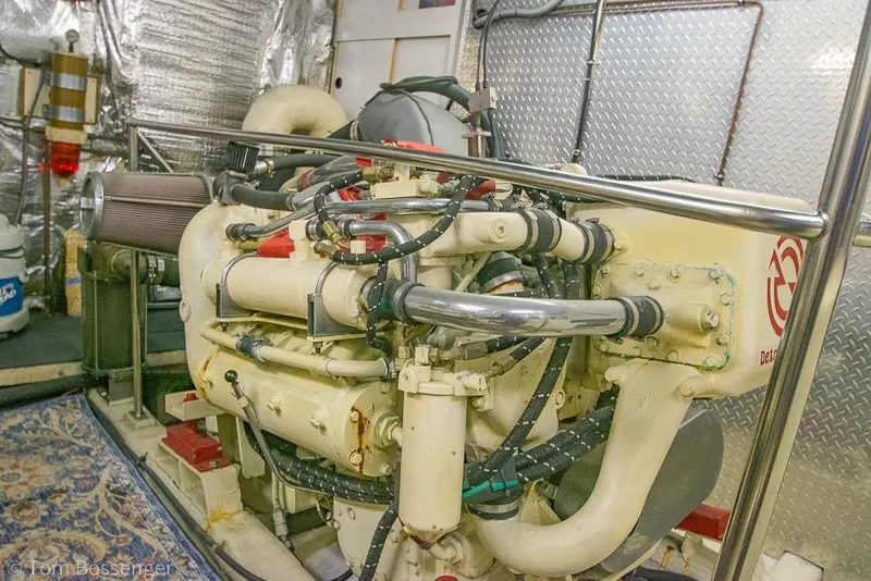 Slide: The Image of Engine room of a 1990 Kha Shing Flush Deck Motor Yacht, featuring detailed machinery. - 64