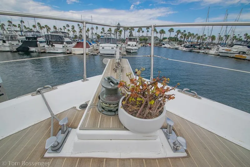 Slide: The Image of Bow view of 1990 Kha Shing Flush Deck Motor Yacht in marina. - 58