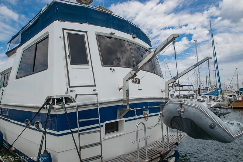 Slide: The Image of 1990 Kha Shing Flush Deck Motor Yacht docked with inflatable boat, San Diego marina. - 61