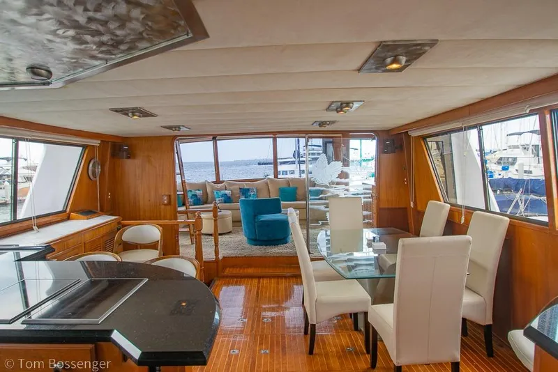 Slide: The Image of Luxurious interior of 1990 Kha Shing Flush Deck Motor Yacht with elegant seating and dining area. - 8