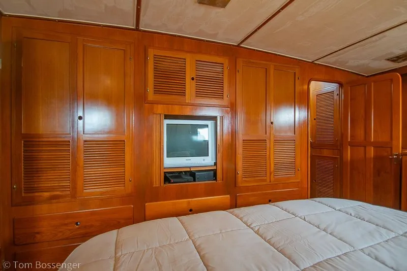 Slide: The Image of Luxurious wood-paneled cabin interior of 1990 Kha Shing Flush Deck Motor Yacht. - 19