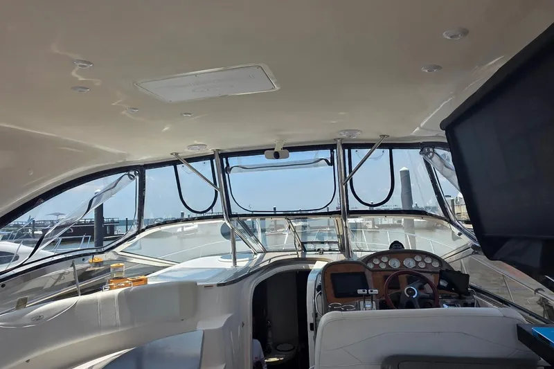 Slide: The Image of Interior view of 2005 Regal Commodore 4060 yacht cockpit with dashboard and controls. - 17