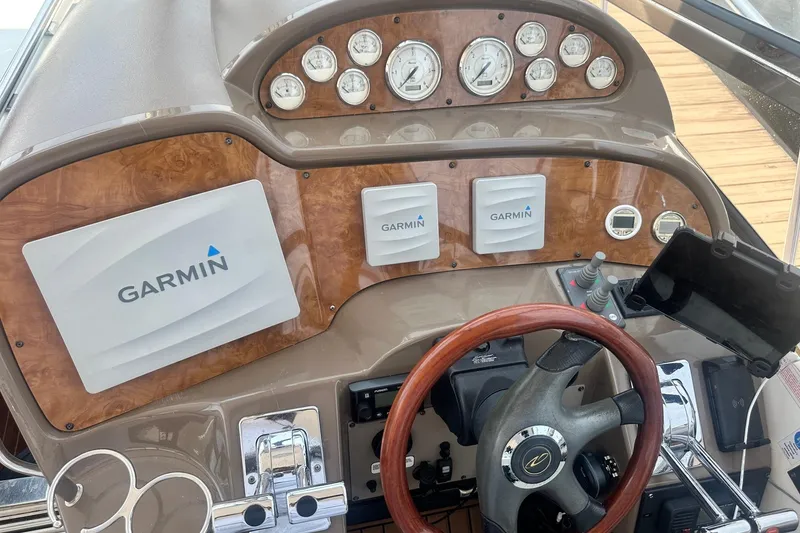 Slide: The Image of Helm of 2005 Regal Commodore 4060 with Garmin navigation and wood accents. - 19