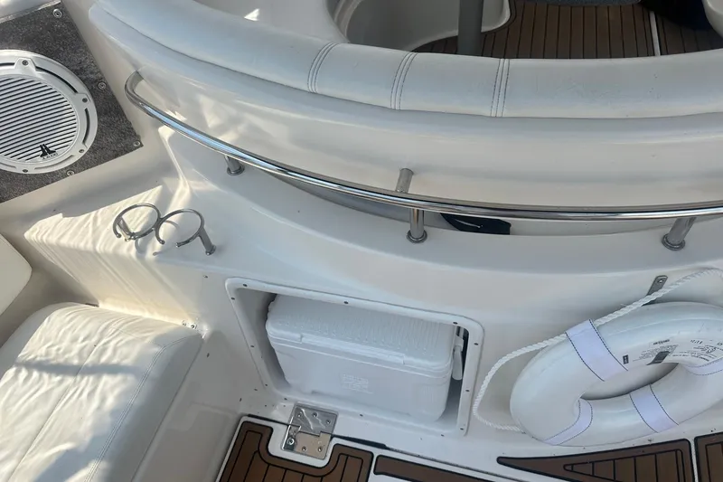 Slide: The Image of Interior of 2005 Regal Commodore 4060 boat with seating, speaker, and life preserver. - 12