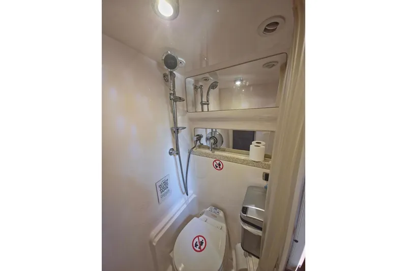 Slide: The Image of Compact bathroom in 2005 Regal Commodore 4060 yacht with shower and toilet. - 28