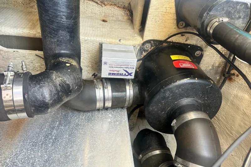 Slide: The Image of Engine compartment of a 2005 Regal Commodore 4060 with visible hoses and components. - 30