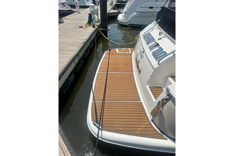 Slide: The Image of 2005 Regal Commodore 4060 yacht docked with teak swim platform. - 5