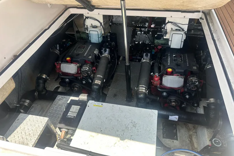 Slide: The Image of Engine compartment of a 2005 Regal Commodore 4060 boat, featuring dual Volvo Penta engines. - 35