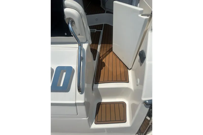Slide: The Image of 2005 Regal Commodore 4060 boat deck with open door and wooden flooring. - 8