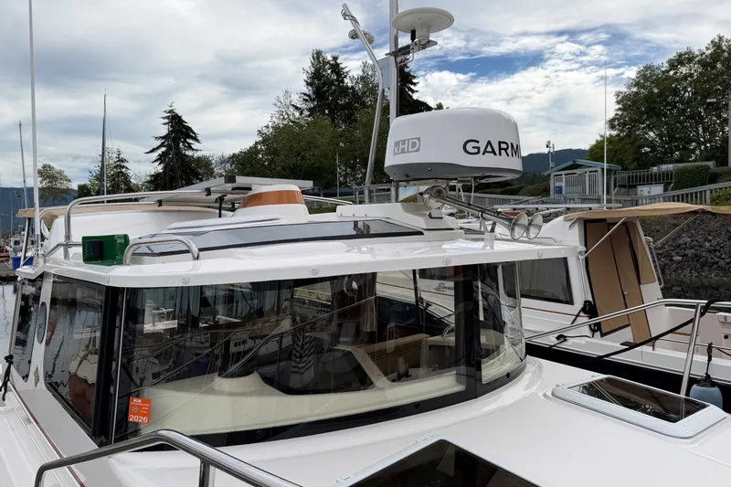 Slide: The Image of 2023 Ranger Tugs R-25 boat with Garmin radar, docked in a marina. - 4