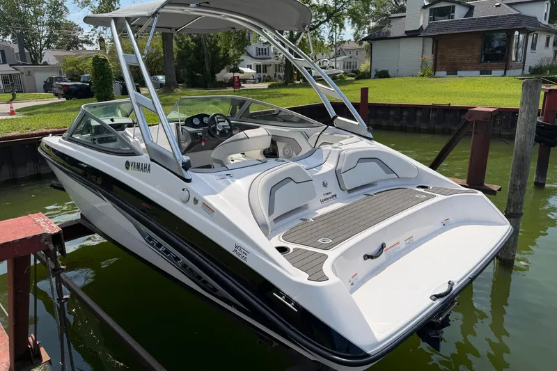 Slide: The Image of 2017 Yamaha AR 190 boat docked, featuring sleek design and spacious interior. - 2