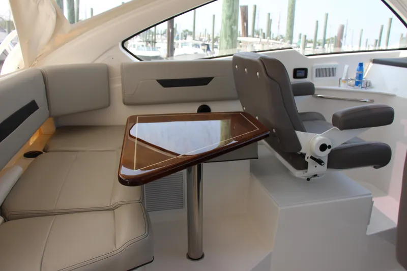 Slide: The Image of Luxurious interior of 2024 Pursuit OS 405 Offshore yacht with seating and table. - 15