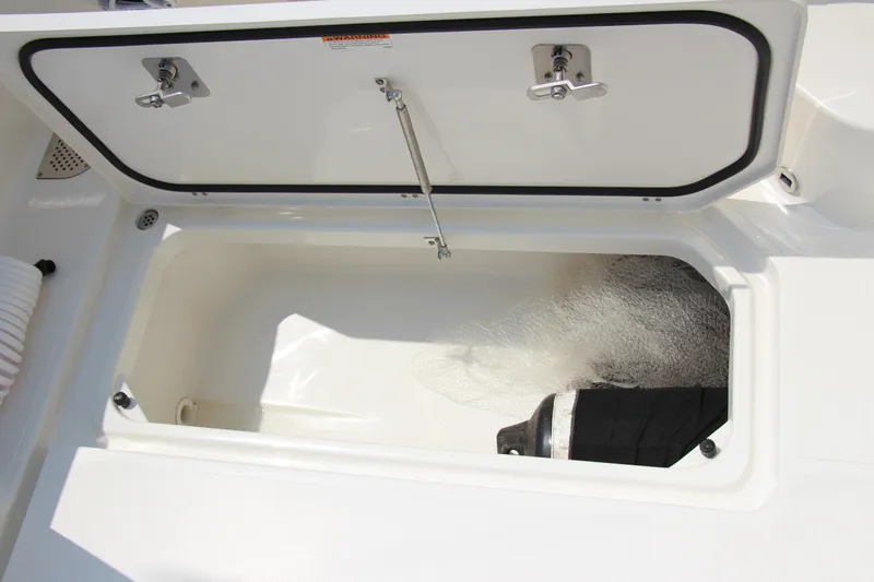 Slide: The Image of Open storage compartment on 2024 Pursuit OS 405 Offshore boat. - 11