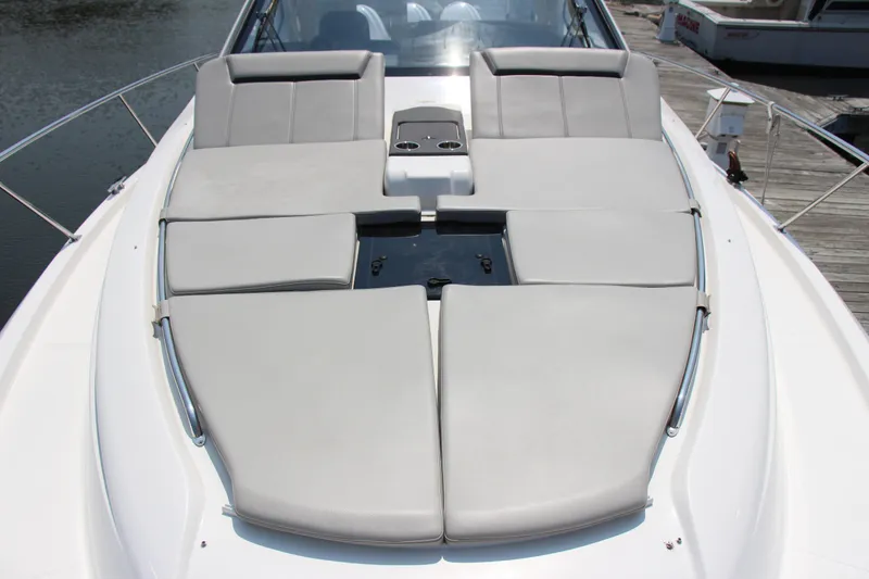 Slide: The Image of 2024 Pursuit OS 405 Offshore boat with spacious sunbathing deck and sleek design. - 6