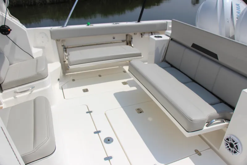 Slide: The Image of 2024 Pursuit OS 405 Offshore boat interior with spacious seating and sleek design. - 12