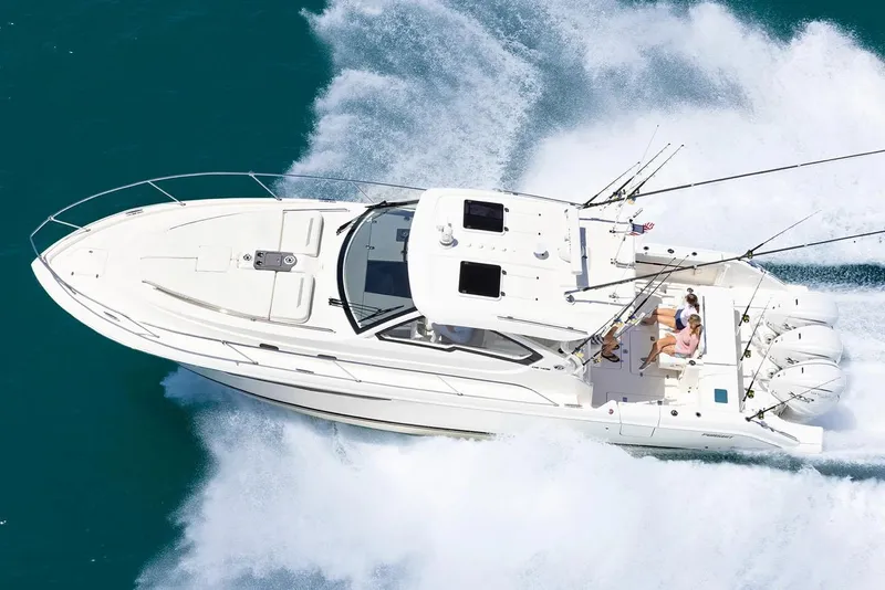 Slide: The Image of Manufacturer Provided Image: 2024 Pursuit OS 405 Offshore boat cruising on open water. - 25
