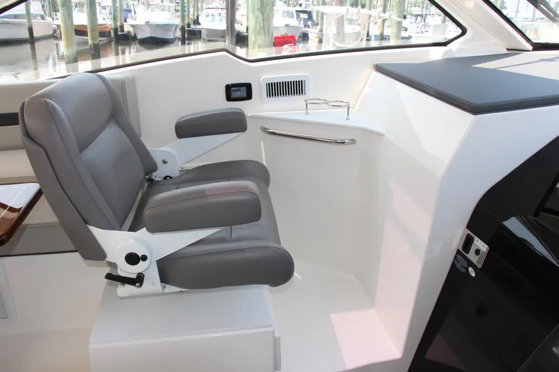 Slide: The Image of 2024 Pursuit OS 405 Offshore boat interior with comfortable seating and modern design. - 18