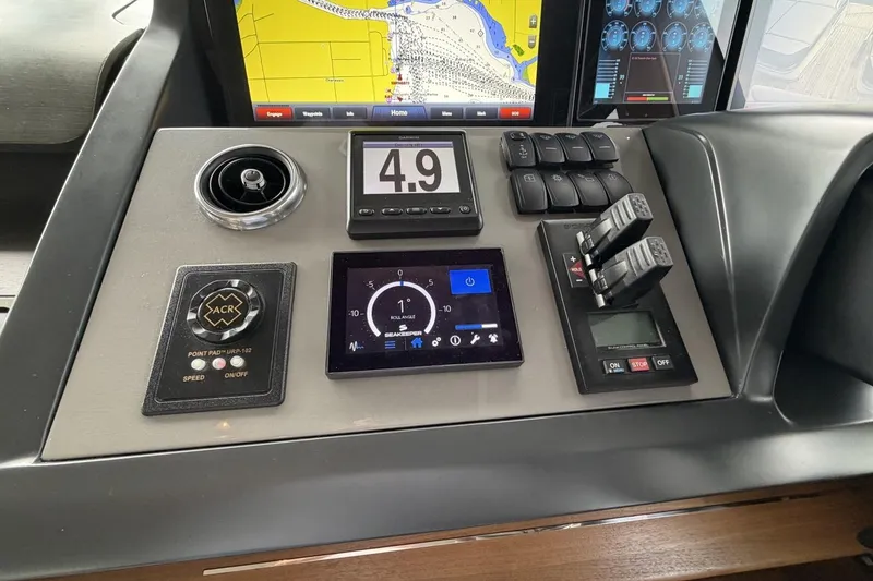 Slide: The Image of Control panel of a 2020 Princess S78 yacht with navigation and throttle controls. - 50