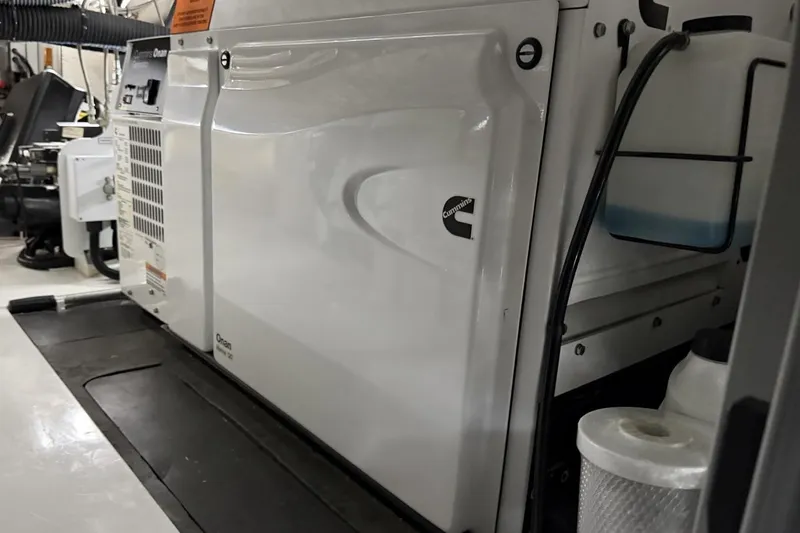 Slide: The Image of Engine room of a 2020 Princess S78 yacht featuring a Cummins Onan generator. - 96
