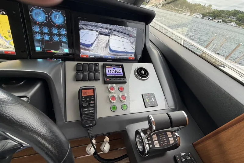 Slide: The Image of Control panel of a 2020 Princess S78 yacht with navigation screens and controls. - 51