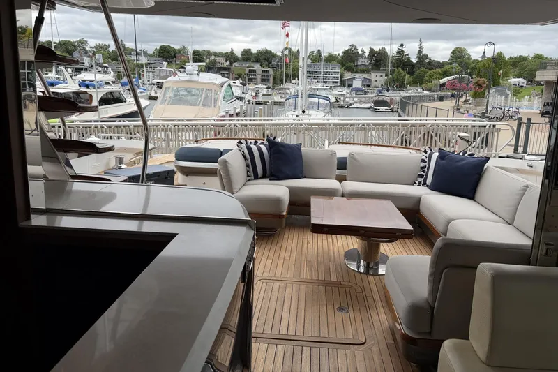Slide: The Image of Luxurious 2020 Princess S78 yacht with elegant outdoor seating and marina view. - 14