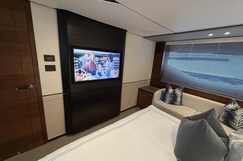 Slide: The Image of Luxurious interior of 2020 Princess S78 yacht with TV, sofa, and elegant decor. - 54