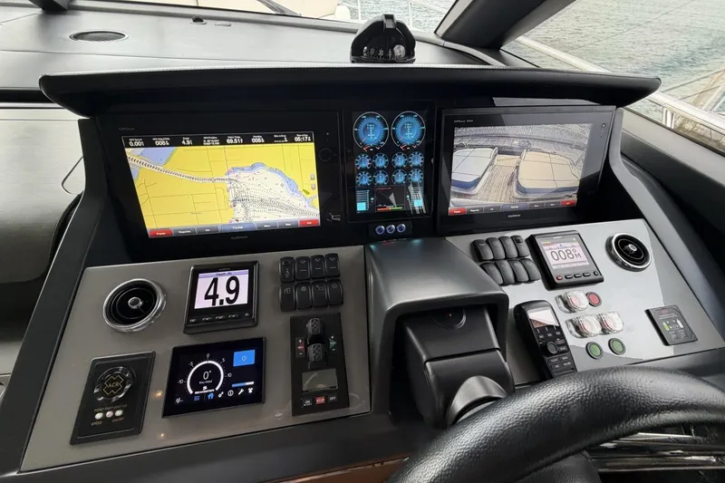 Slide: The Image of Control panel of a 2020 Princess S78 yacht with navigation and monitoring screens. - 49