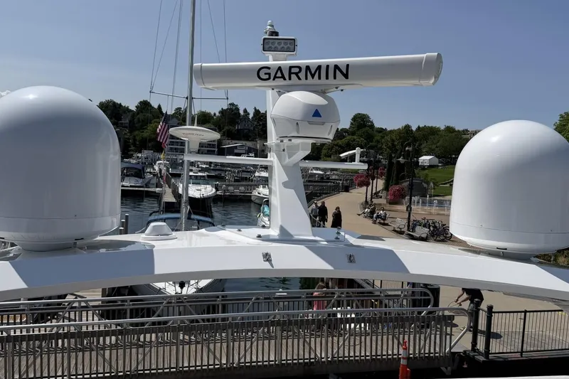 Slide: The Image of 2020 Princess S78 yacht with Garmin radar, docked at a marina under clear skies. - 88