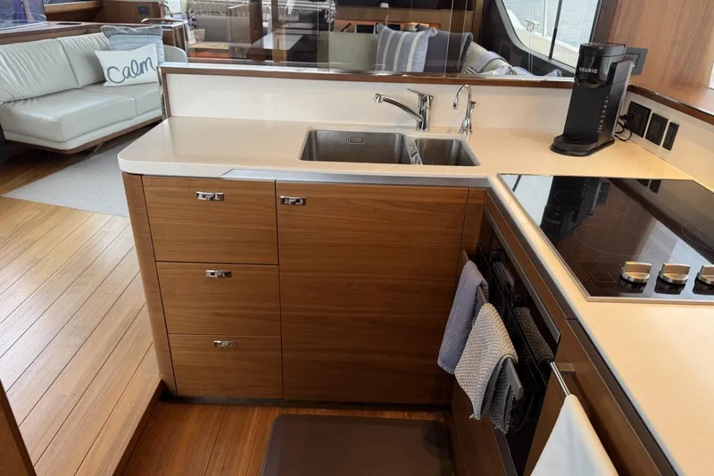 Slide: The Image of Luxurious kitchen interior of 2020 Princess S78 yacht with modern appliances and wooden cabinetry. - 38