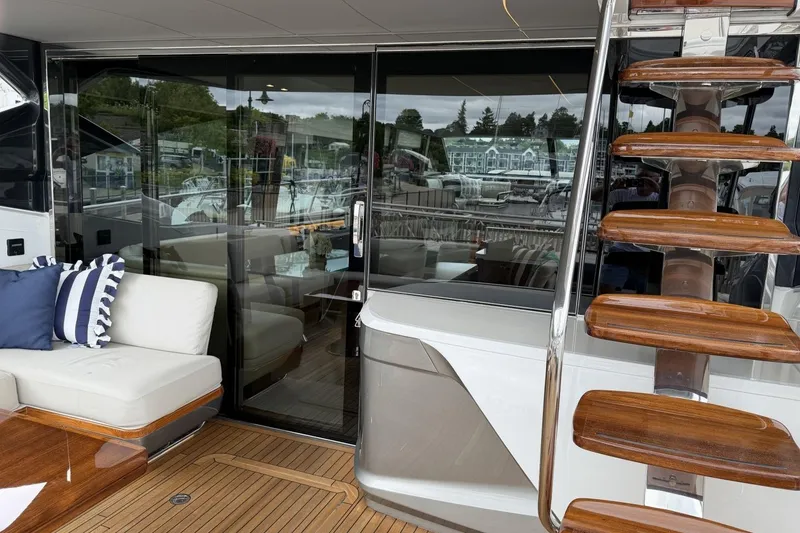 Slide: The Image of Luxurious 2020 Princess S78 yacht interior with elegant seating and wooden staircase. - 85