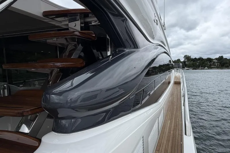 Slide: The Image of Sleek 2020 Princess S78 yacht with modern design on a calm waterway. - 1