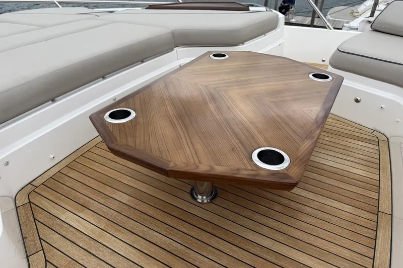 Slide: The Image of Luxurious teak table on 2020 Princess S78 yacht deck, featuring cup holders. - 82