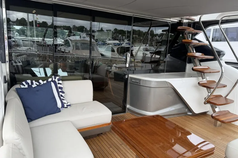 Slide: The Image of Luxurious 2020 Princess S78 yacht interior with elegant seating and spiral staircase. - 10