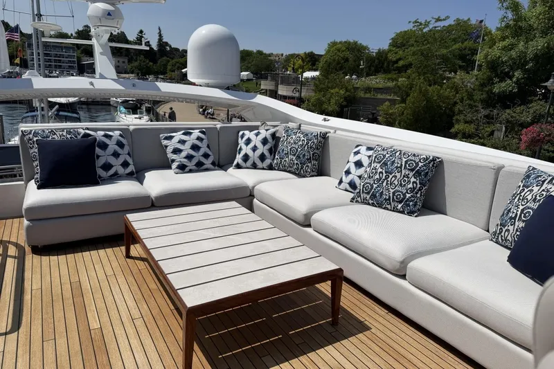 Slide: The Image of Luxurious outdoor seating on 2020 Princess S78 yacht with patterned cushions and wooden deck. - 73