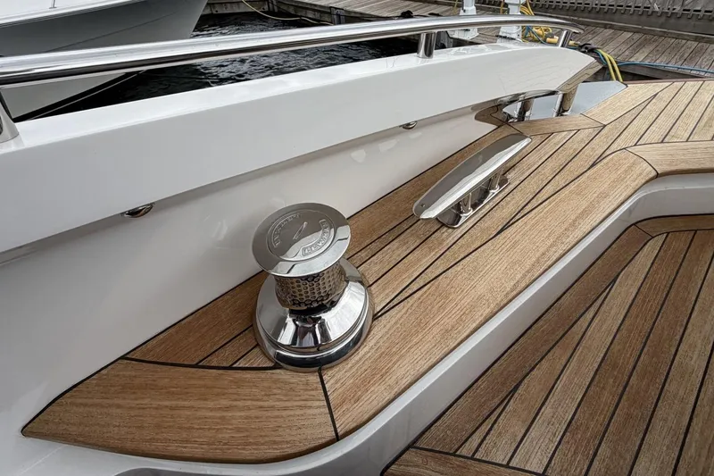 Slide: The Image of Luxury yacht deck with teak wood finish, featuring stainless steel fittings, Princess S78 2020 model. - 9