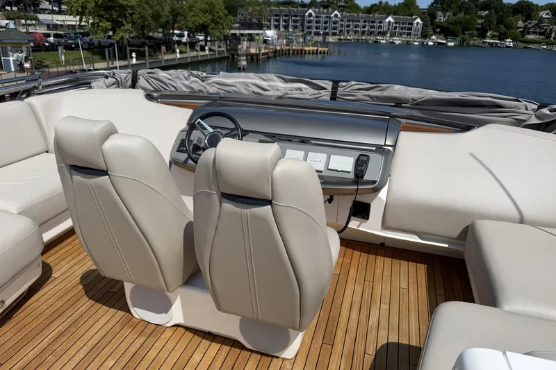 Slide: The Image of Luxurious 2020 Princess S78 yacht interior with plush seating and sleek dashboard design. - 69