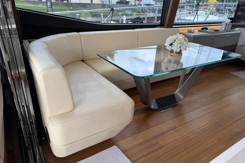 Slide: The Image of Luxurious 2020 Princess S78 yacht interior with elegant seating and glass table. - 42