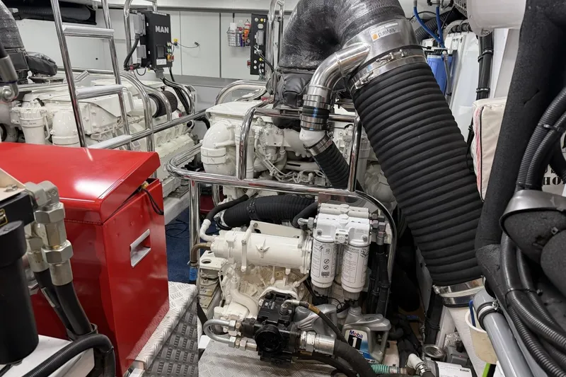 Slide: The Image of Engine room of a 2020 Princess S78 yacht, featuring complex machinery and components. - 92