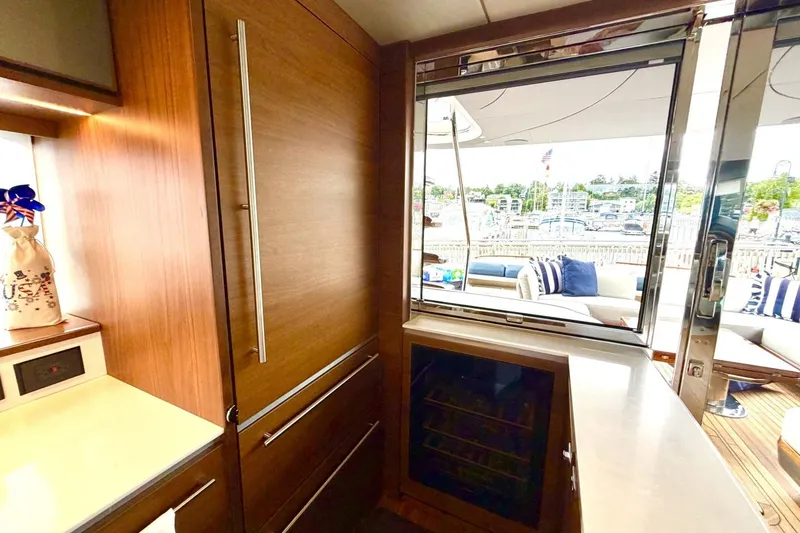 Slide: The Image of Luxurious interior of 2020 Princess S78 yacht with sleek wood finishes and outdoor seating view. - 39