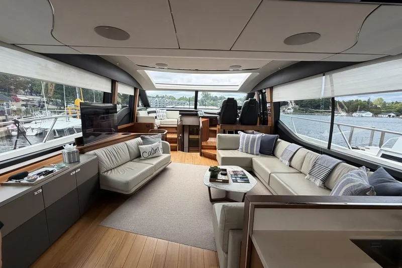 Slide: The Image of Luxurious interior of a 2020 Princess S78 yacht with elegant seating and panoramic windows. - 26