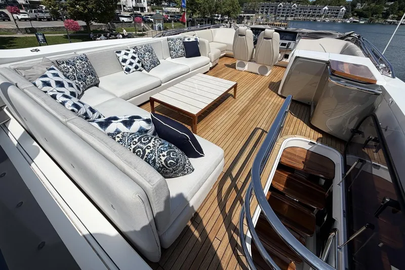Slide: The Image of Luxurious 2020 Princess S78 yacht deck with elegant seating and scenic marina view. - 7