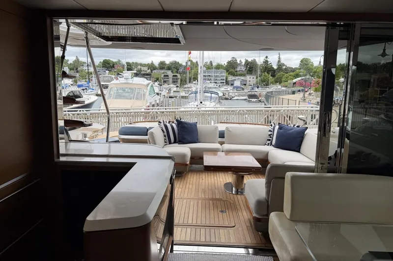 Slide: The Image of Luxurious 2020 Princess S78 yacht interior with elegant seating and marina view. - 15
