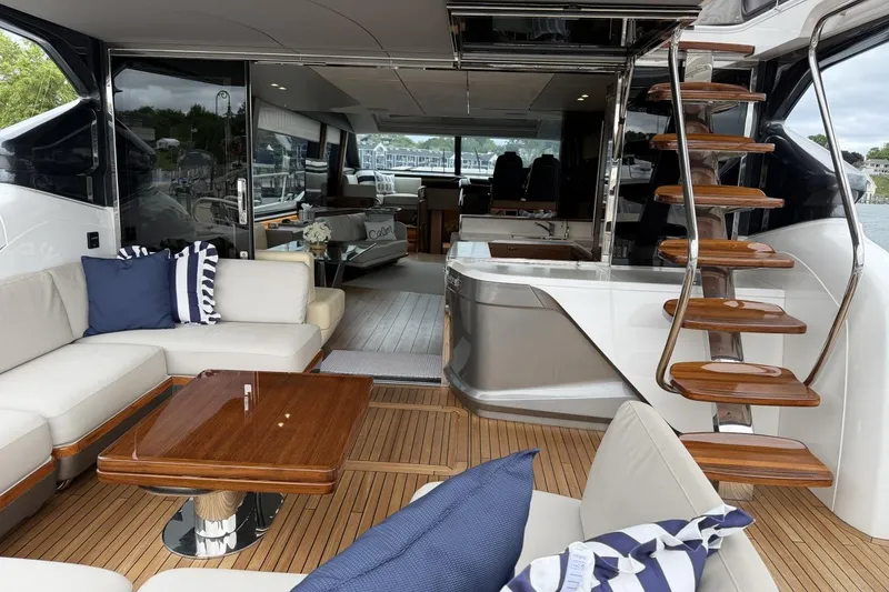 Slide: The Image of Luxurious 2020 Princess S78 yacht interior with elegant seating and wooden staircase. - 12