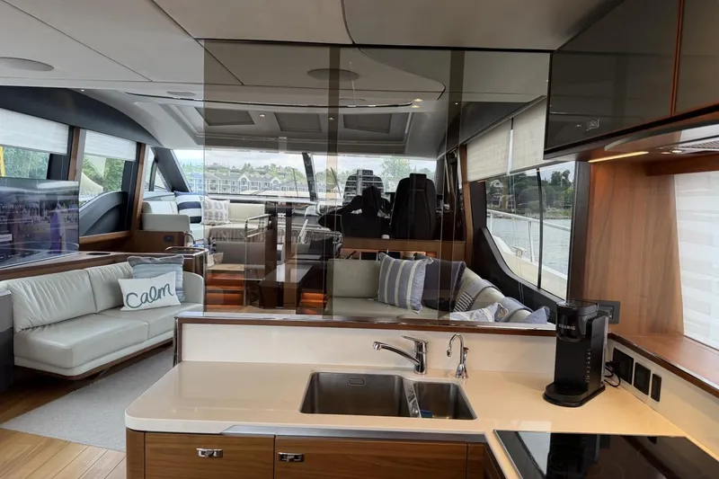 Slide: The Image of Luxurious interior of a 2020 Princess S78 yacht with modern kitchen and seating area. - 32