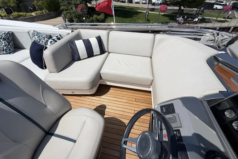 Slide: The Image of Luxurious seating area on 2020 Princess S78 yacht with elegant cushions and teak flooring. - 68