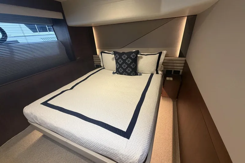 Slide: The Image of Luxurious bedroom interior of 2020 Princess S78 yacht with elegant bedding and ambient lighting. - 64