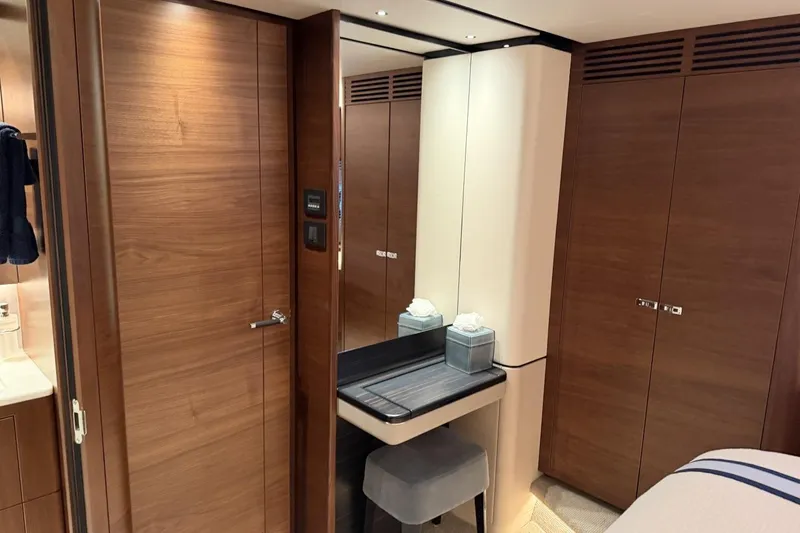 Slide: The Image of Luxurious interior of 2020 Princess S78 yacht with wooden cabinetry and vanity area. - 62