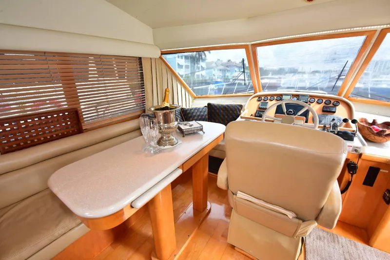 Slide: The Image of Luxurious interior of 2004 Navigator Rival yacht with elegant seating and helm. - 36